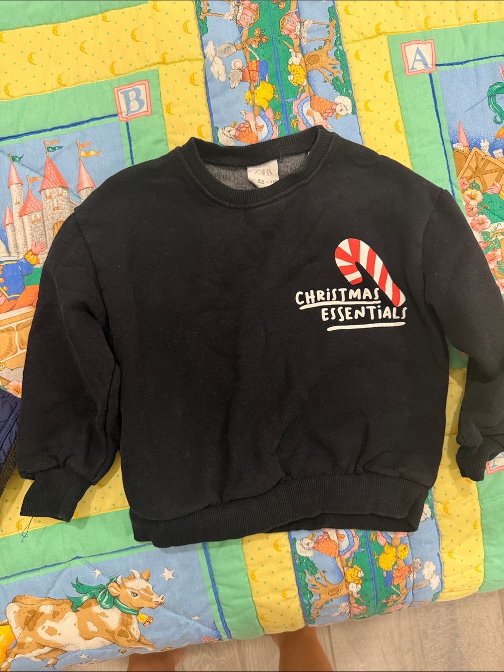 Zara Black Crewneck Sweatshirt with Red & White Candy Cane Graphic